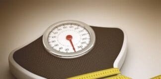 Tape Measure Around The Balance Decreasing Its Measures.