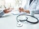 Medicare High Deductible G Plan vs. Advantage PPO Doctors And Patients Consulting And Diagnostic Examining Sit And Talk. At The Table Near The Window In The Hospital Medicine Concept