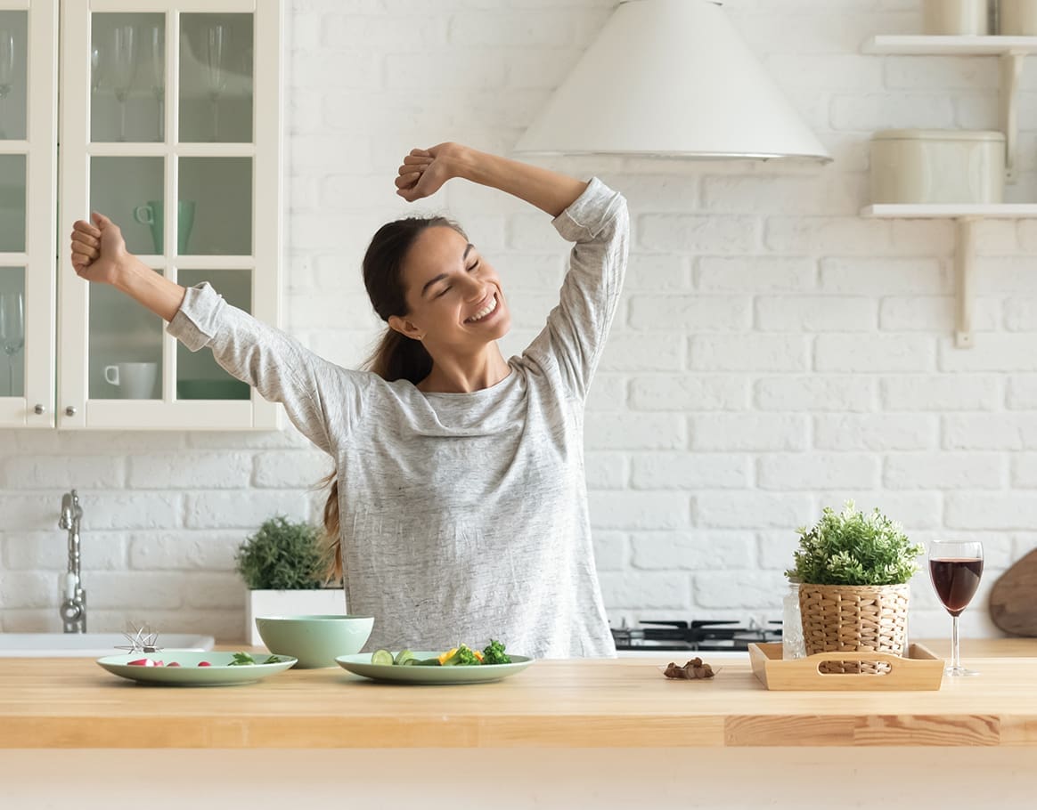 Happy Millennial Woman Have Fun Cooking Breakfast In Kitchen