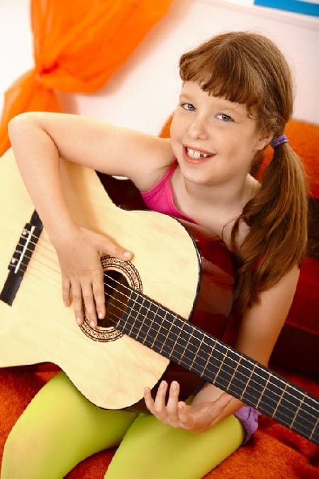 Cute Schoolgirl With Guitar
