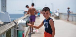 Young Angler Recylces Fishing Line In One Cba S Recycling Bins Located On Okaloosa Island Pier.