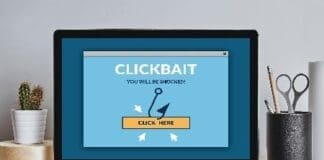 Clickbait Concept On Laptop Screen On Modern Desk
