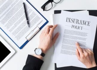 Business Woman Examining Insurance Policy