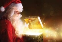 Grateful for a Year of Giving Santa Claus Opening Christmas Present With Shiny Stars