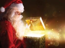 Santa Claus Opening Christmas Present With Shiny Stars