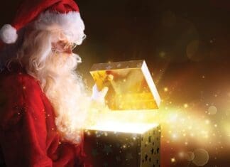 Santa Claus Opening Christmas Present With Shiny Stars