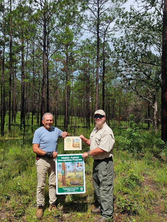 Fwc Biologist Ed O'daniels Presenting Landowner Michael Jenkins With His Certificate And Sign. Photo By Ian Stone Uf Ifas