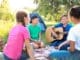 Group Of Children Resting At Summer Camp