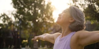 Asia Adult Aged People Middle Age Mindful Happy Old Woman Open Arm Yoga Deep Calm Stress Relief Outdoor Nature Public Park Sun Light Self Love Relax Elder Aging Life Asian Female Mental Health Care.