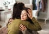 Bring Hope Now: Local Nonprofit Aims to Solve Youth Mental Health Crisis Teenage Girl Hugging Her Mother At Home.