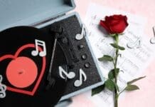 Composition,with,rose,flower,,record,player,,sheet,notes,and,decorative