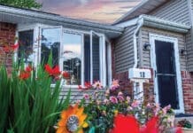 Front Of House With Natural Light With Flowers