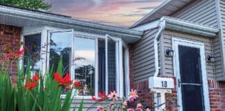 Front Of House With Natural Light With Flowers