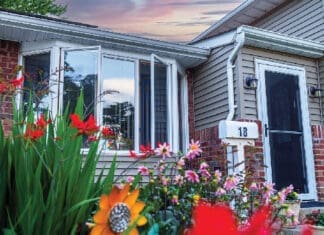 Front Of House With Natural Light With Flowers