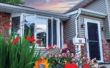 Front Of House With Natural Light With Flowers