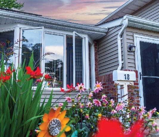 Front Of House With Natural Light With Flowers