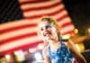 Events Baytowne Girl In Front Of Flag